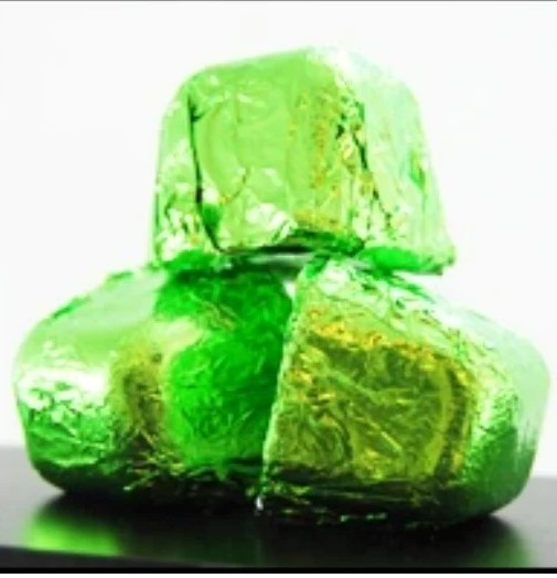 Shower infusers wrapped in bright green foil